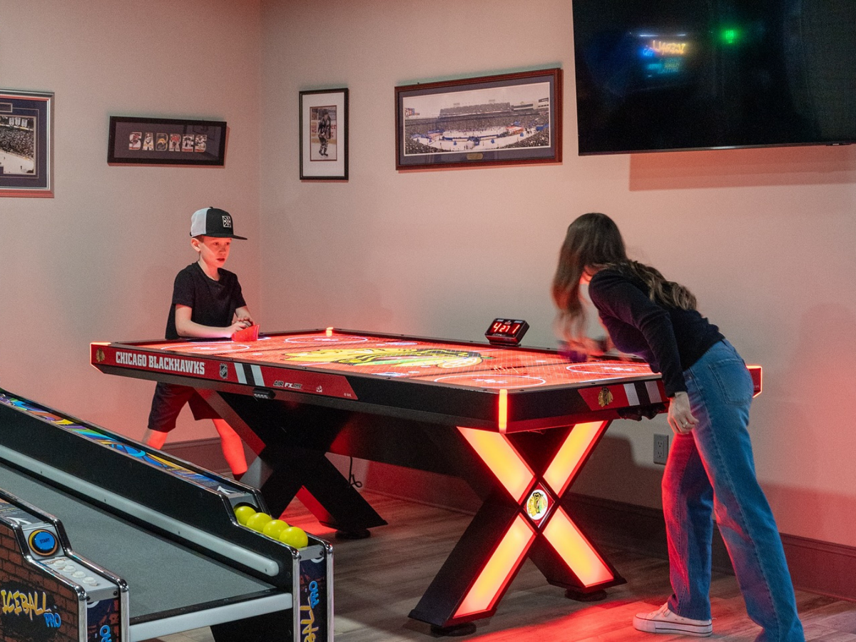 Home Air FX Pro 8-foot air hockey table with LED-backlit playfield, powder-coated steel frame, and hardwood accents.