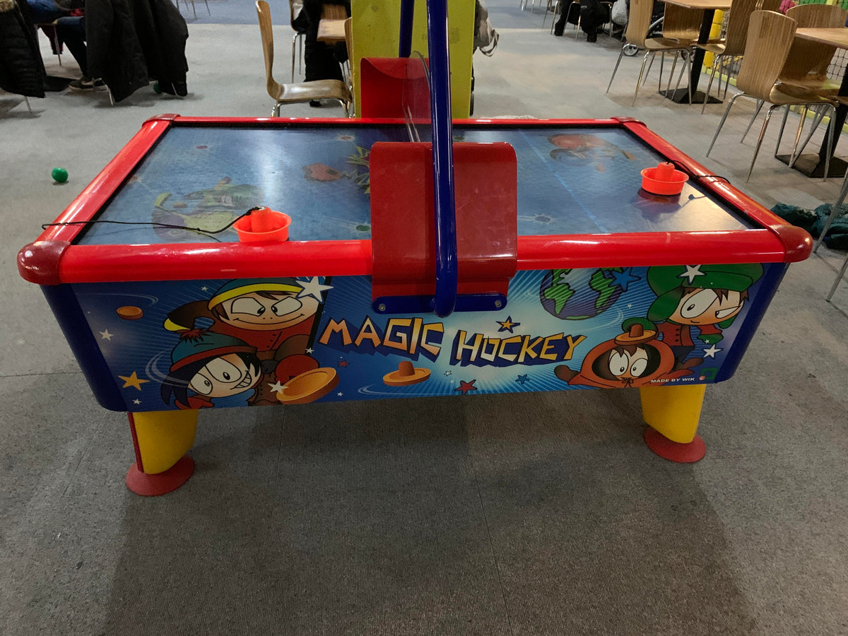 Magic Air Hockey kids table with colorful cabinet, light and sound effects for fun gameplay.