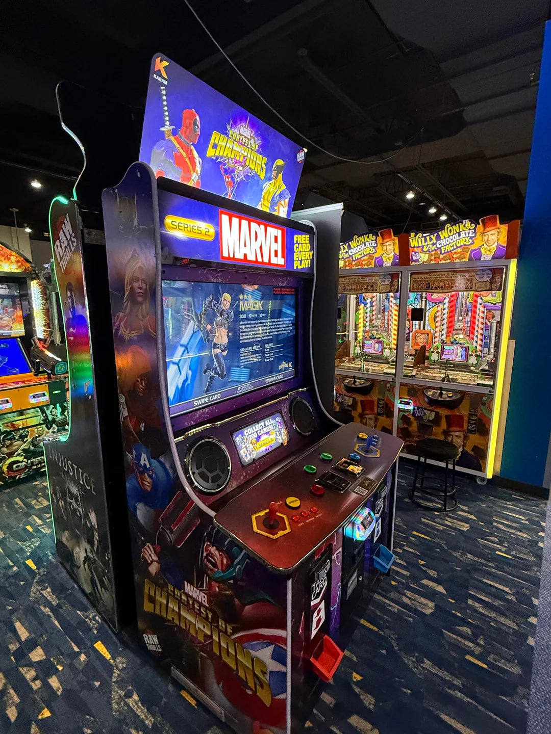 Marvel Contest of Champions arcade machine with 43-inch HD display, 2-player 3v3 fighting gameplay, and collectible champion cards.