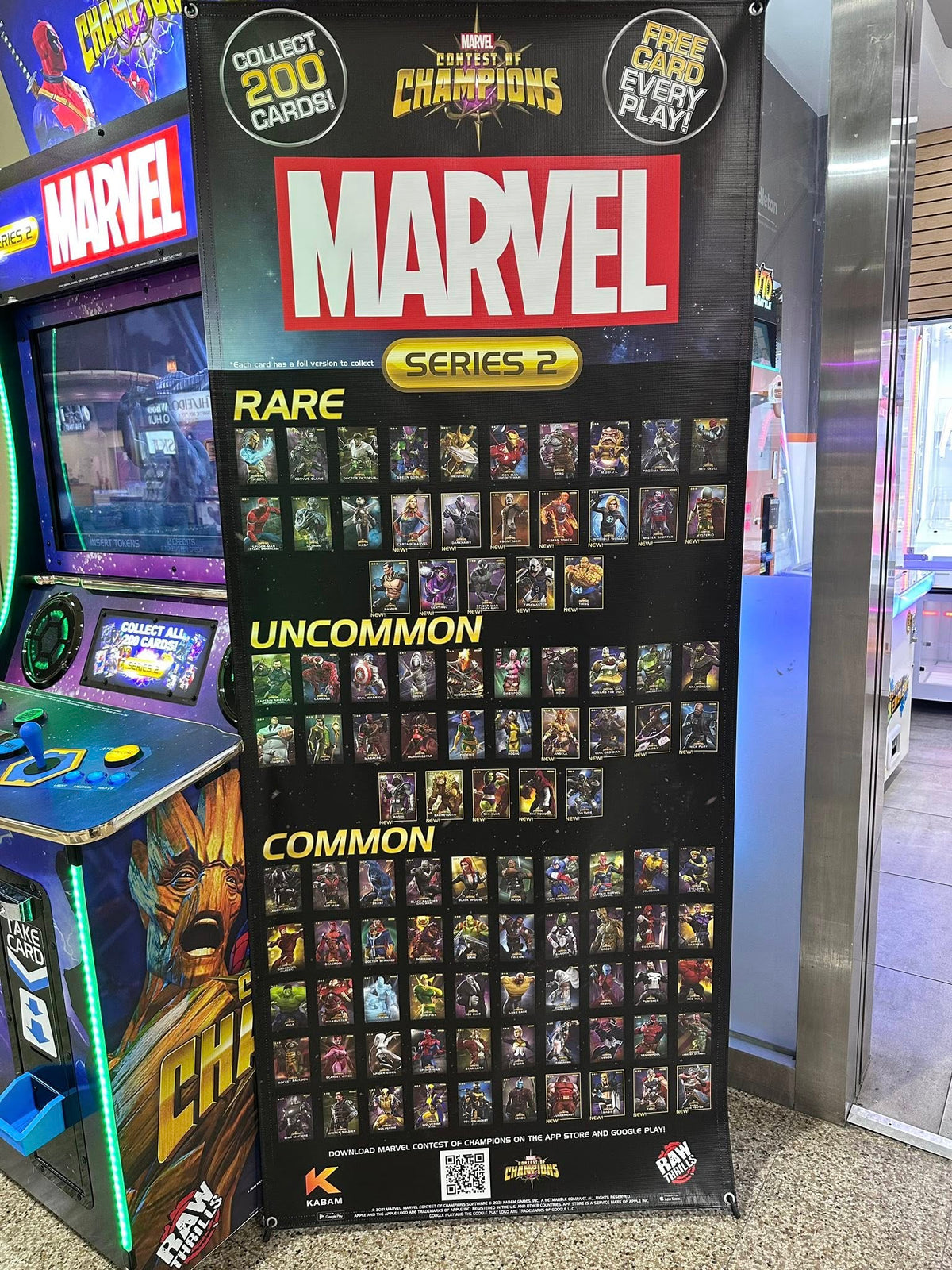 Marvel Contest of Champions arcade machine with 43-inch HD display, 2-player 3v3 fighting gameplay, and collectible champion cards.