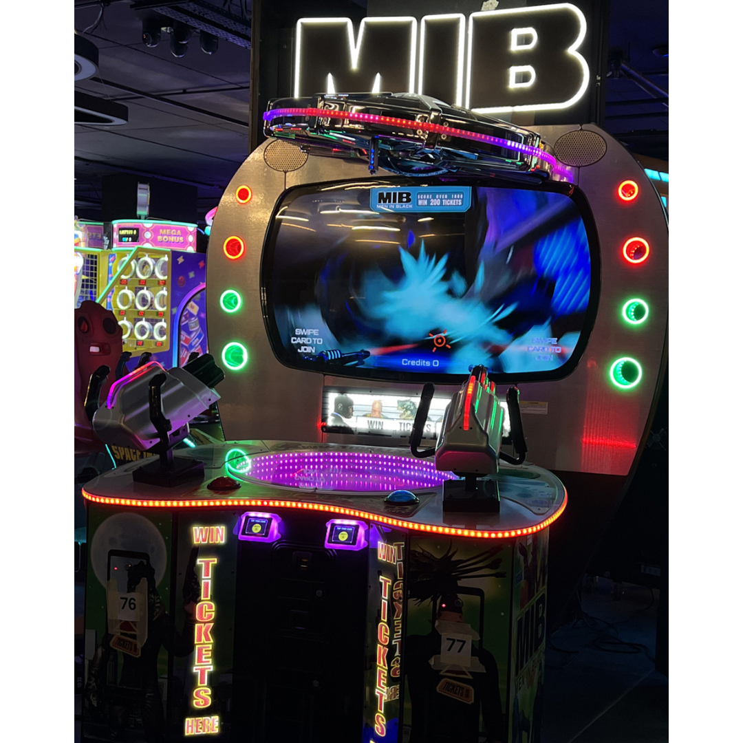 Men in Black skill-based video redemption arcade machine with interactive shooting gameplay and themed graphics