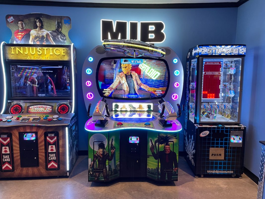 Men in Black skill-based video redemption arcade machine with interactive shooting gameplay and themed graphics