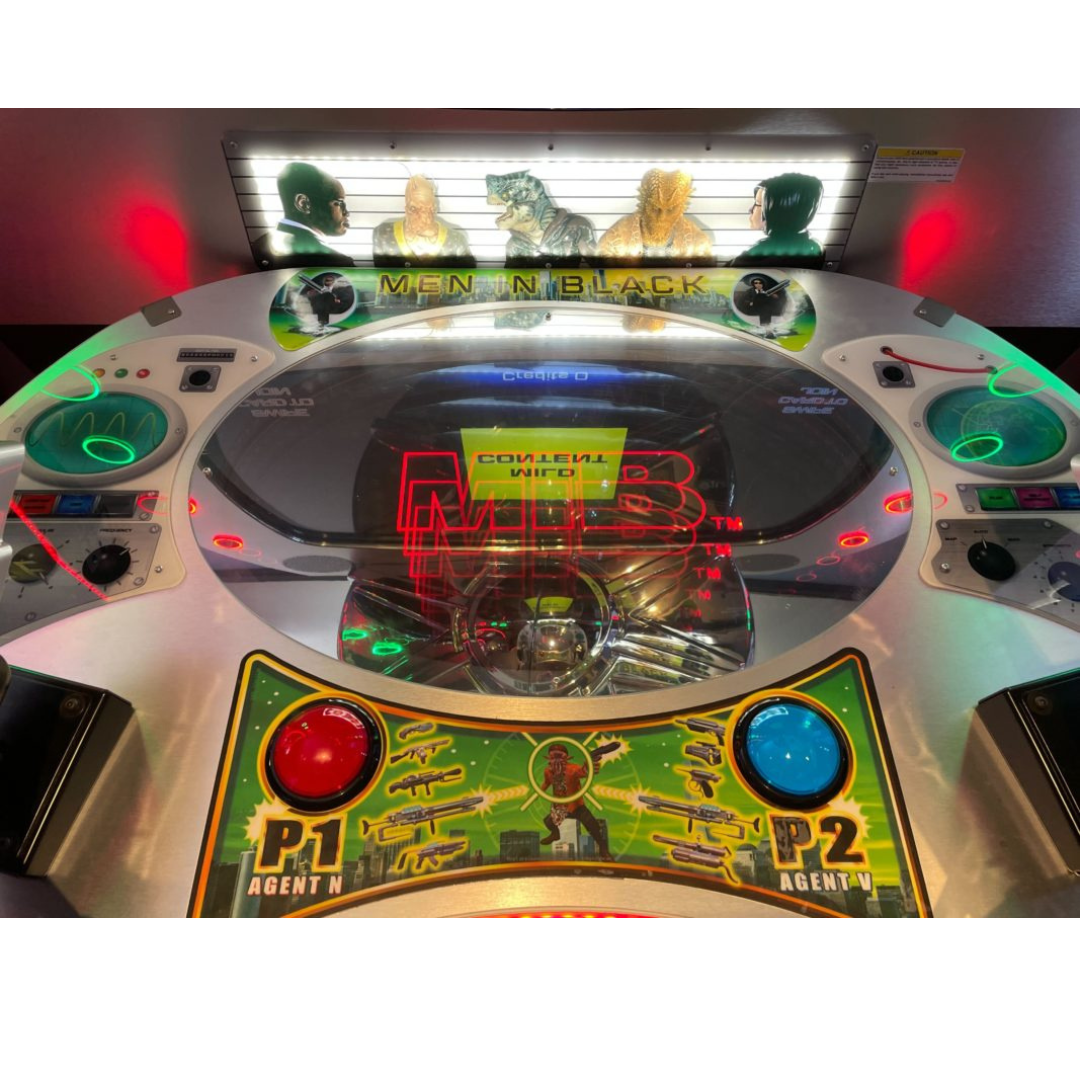 Men in Black skill-based video redemption arcade machine with interactive shooting gameplay and themed graphics