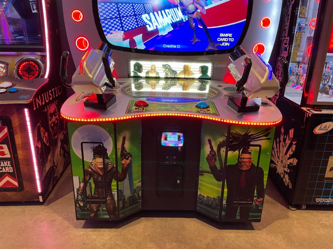 Men in Black skill-based video redemption arcade machine with interactive shooting gameplay and themed graphics