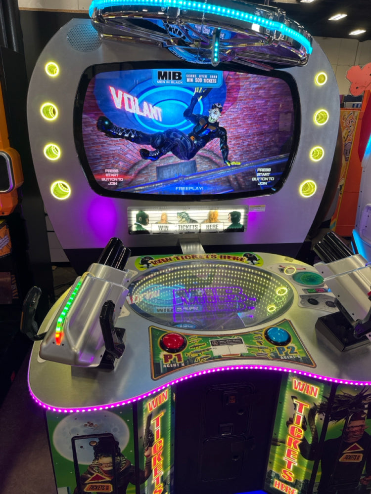 Men in Black skill-based video redemption arcade machine with interactive shooting gameplay and themed graphics