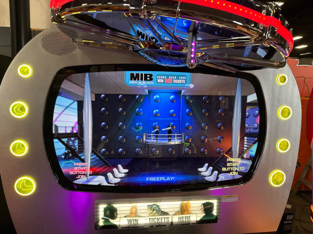 Men in Black skill-based video redemption arcade machine with interactive shooting gameplay and themed graphics