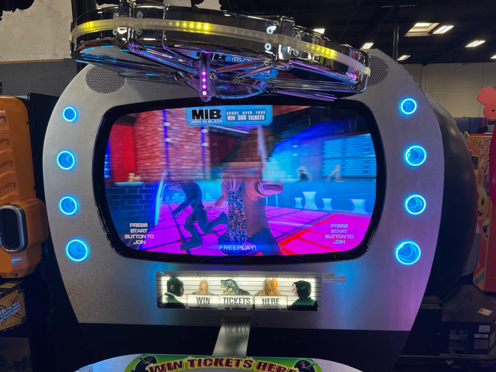 Men in Black skill-based video redemption arcade machine with interactive shooting gameplay and themed graphics