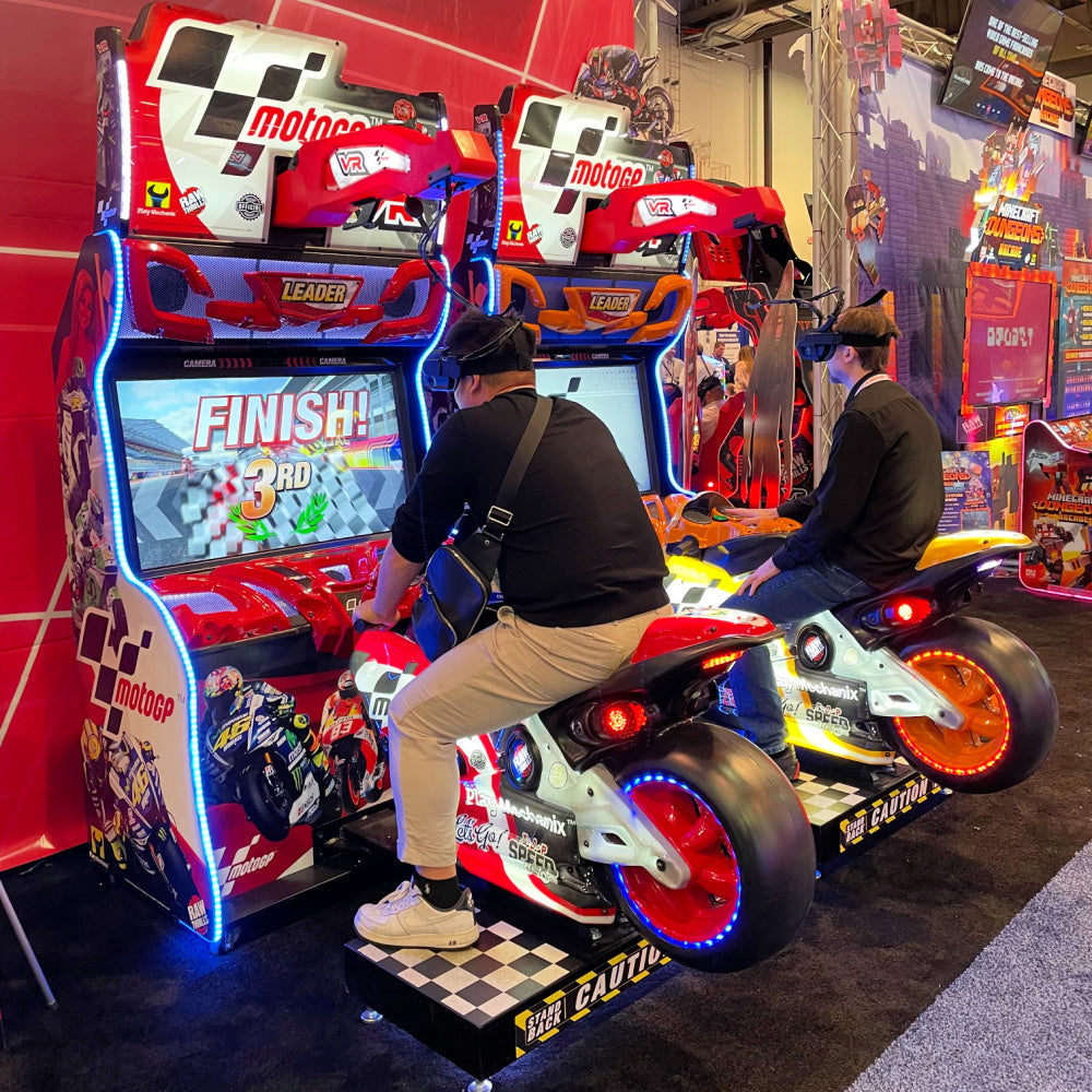 MotoGP VR arcade machine with 360° virtual reality motorcycle racing, official tracks, and HP Reverb G2 headset.