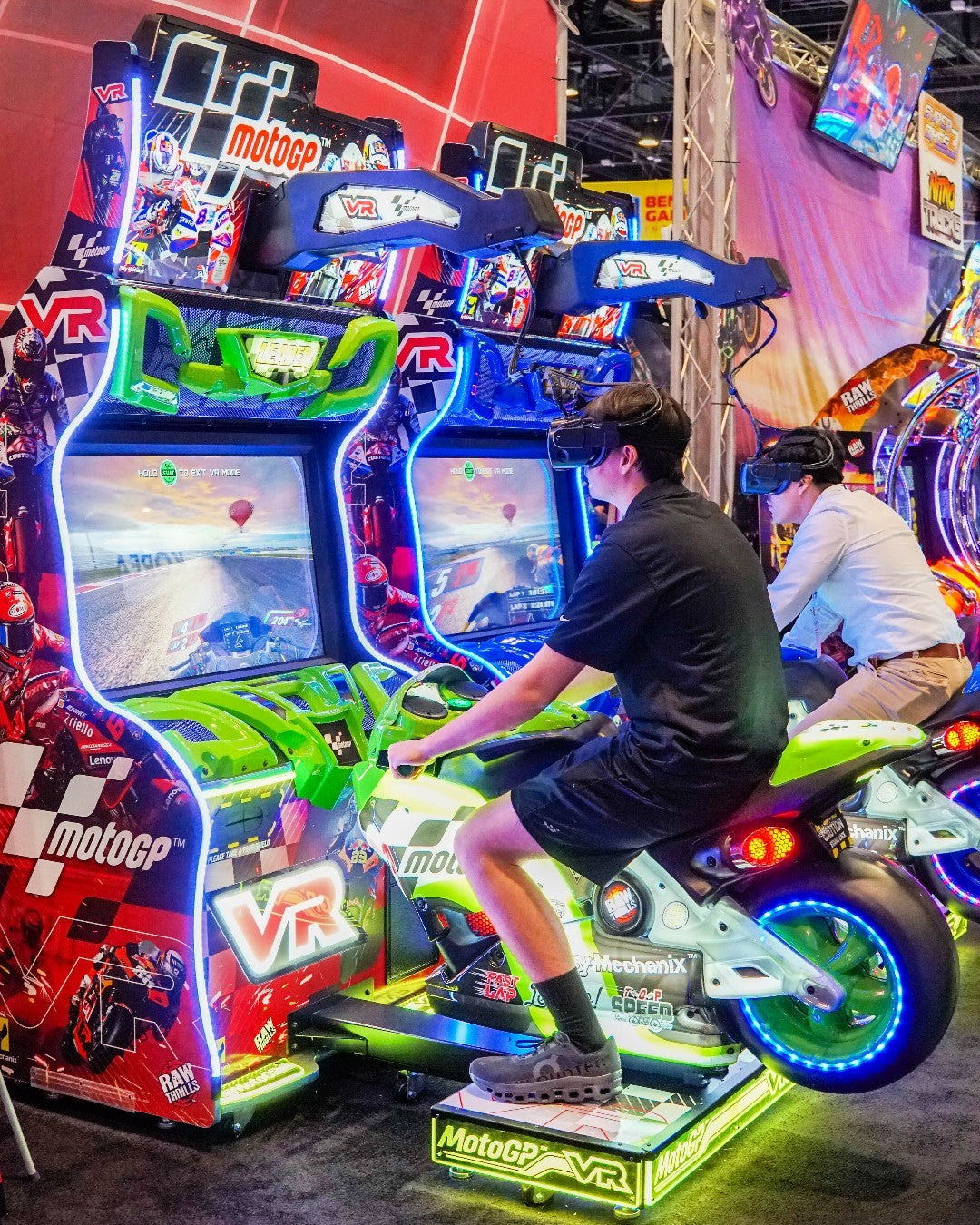 MotoGP VR arcade machine with 360° virtual reality motorcycle racing, official tracks, and HP Reverb G2 headset.