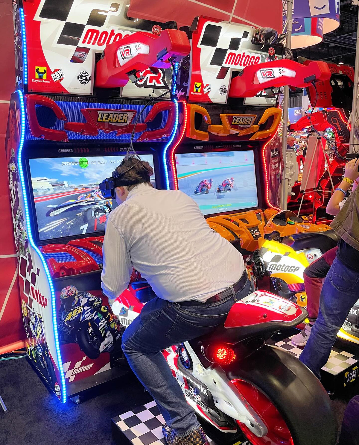 MotoGP VR arcade machine with 360° virtual reality motorcycle racing, official tracks, and HP Reverb G2 headset.