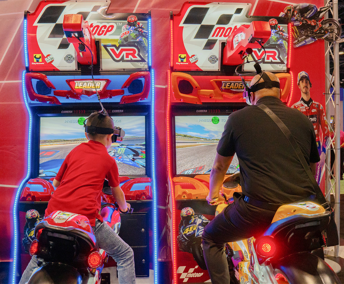 MotoGP VR arcade machine with 360° virtual reality motorcycle racing, official tracks, and HP Reverb G2 headset.