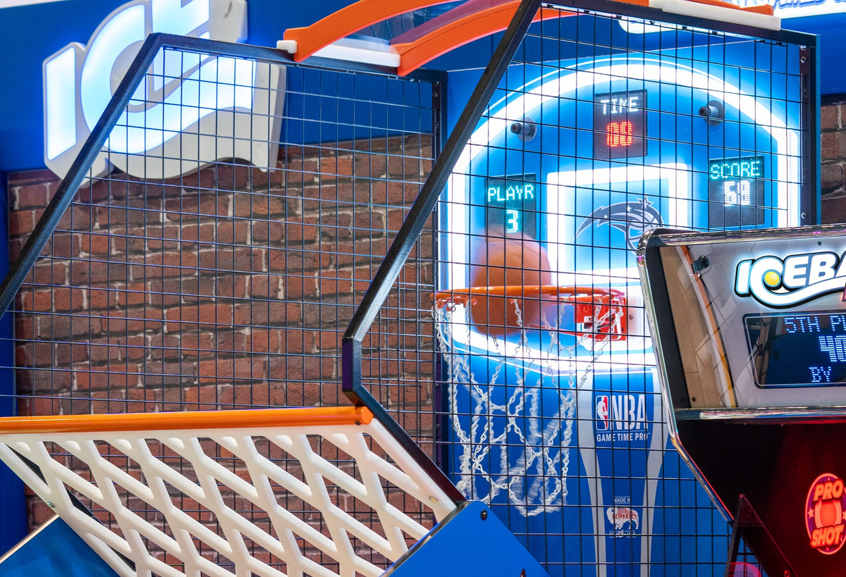 NBA Game Time Pro 8-foot basketball arcade by ICE Games with real hardwood floor, adjustable height, and 4-player Pop-A-Shot gameplay.