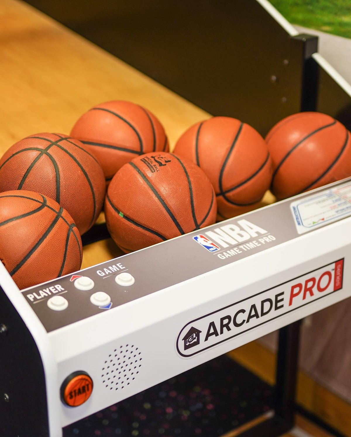 NBA Game Time Pro 8-foot basketball arcade by ICE Games with real hardwood floor, adjustable height, and 4-player Pop-A-Shot gameplay.