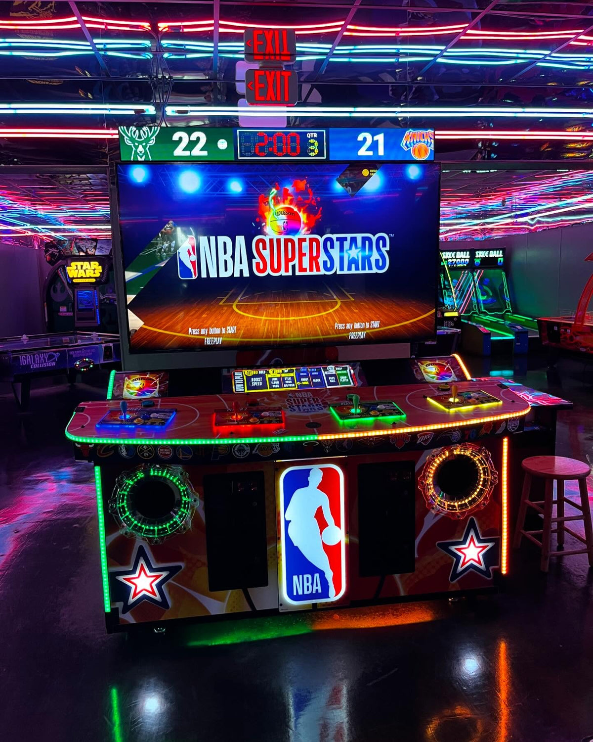 NBA Superstars arcade machine with 4-player basketball gameplay, 75-inch HD display, and official NBA teams and players.