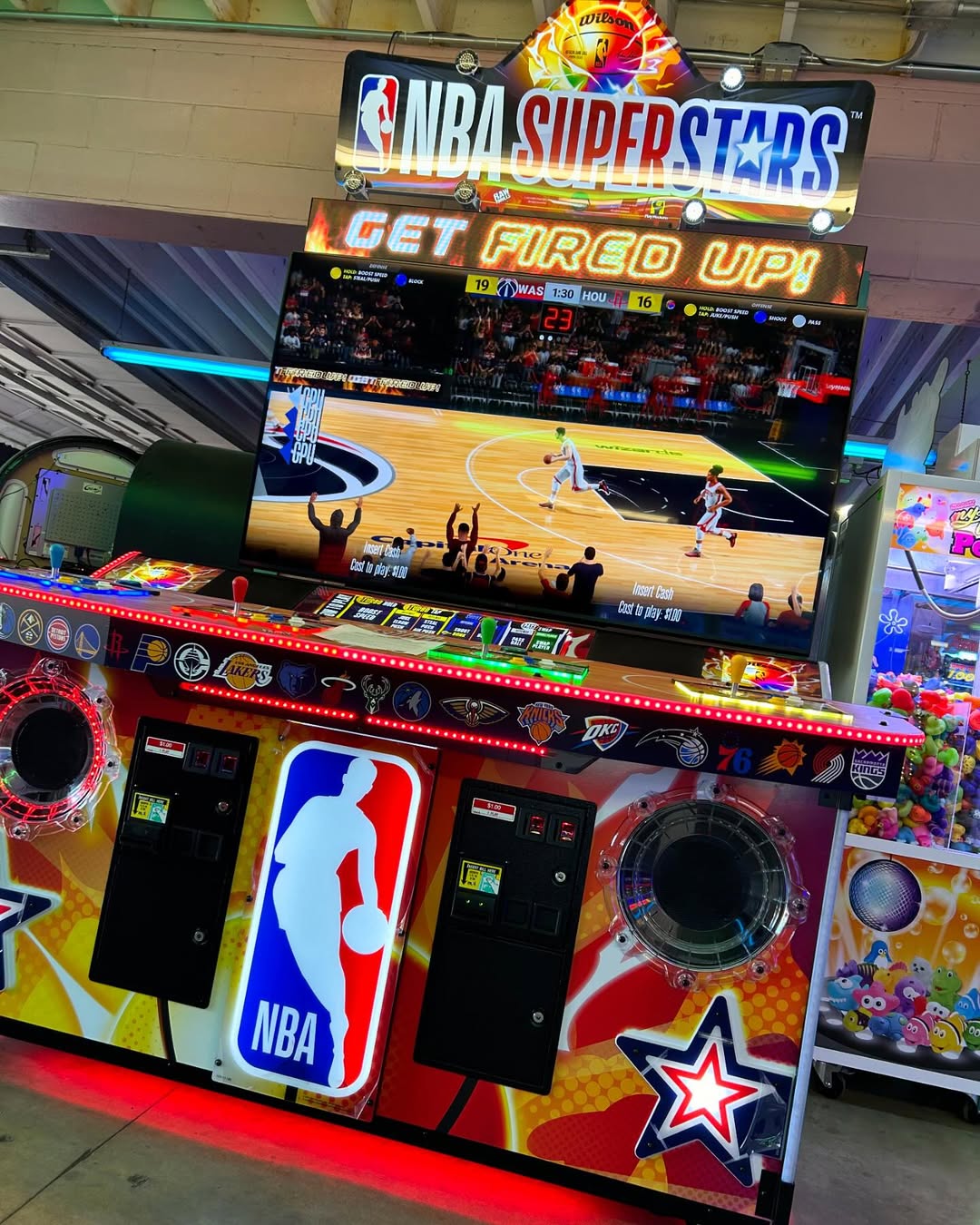 NBA Superstars arcade machine with 4-player basketball gameplay, 75-inch HD display, and official NBA teams and players.