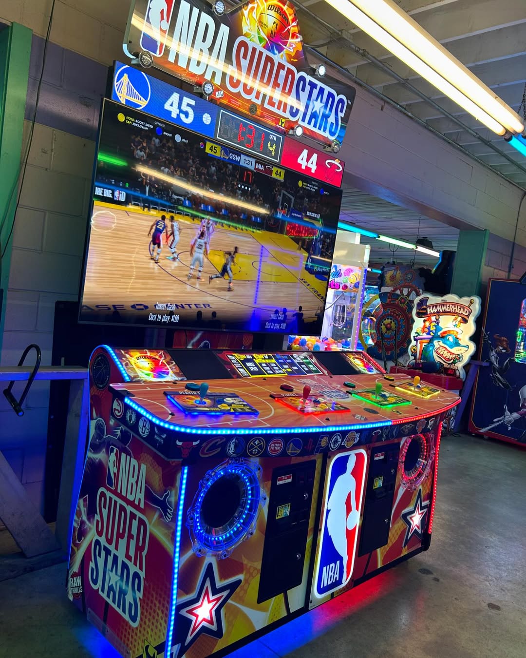 NBA Superstars arcade machine with 4-player basketball gameplay, 75-inch HD display, and official NBA teams and players.