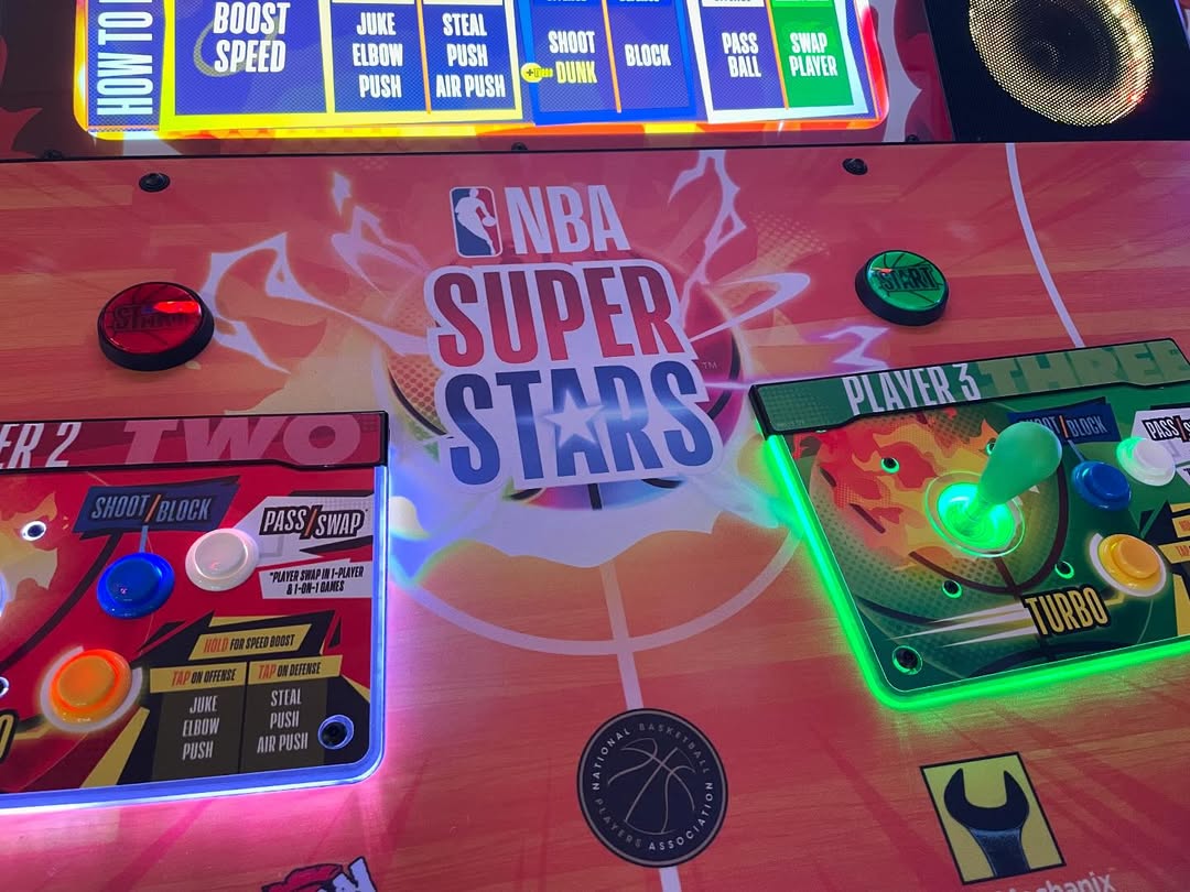 NBA Superstars arcade machine with 4-player basketball gameplay, 75-inch HD display, and official NBA teams and players.