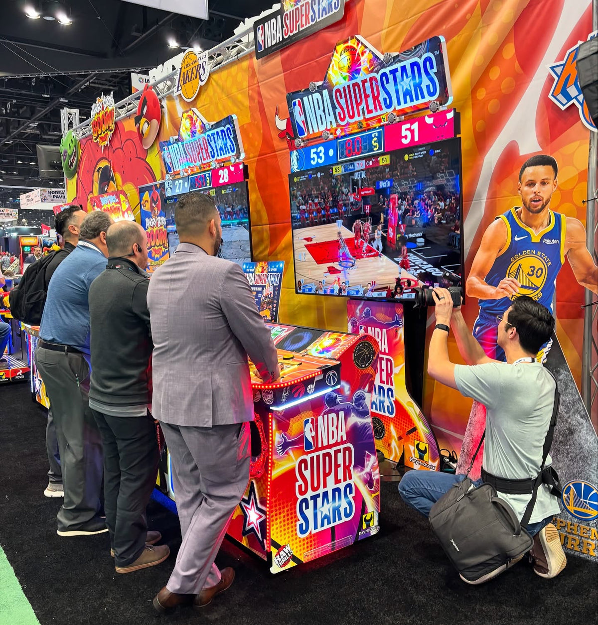 NBA Superstars arcade machine with 4-player basketball gameplay, 75-inch HD display, and official NBA teams and players.