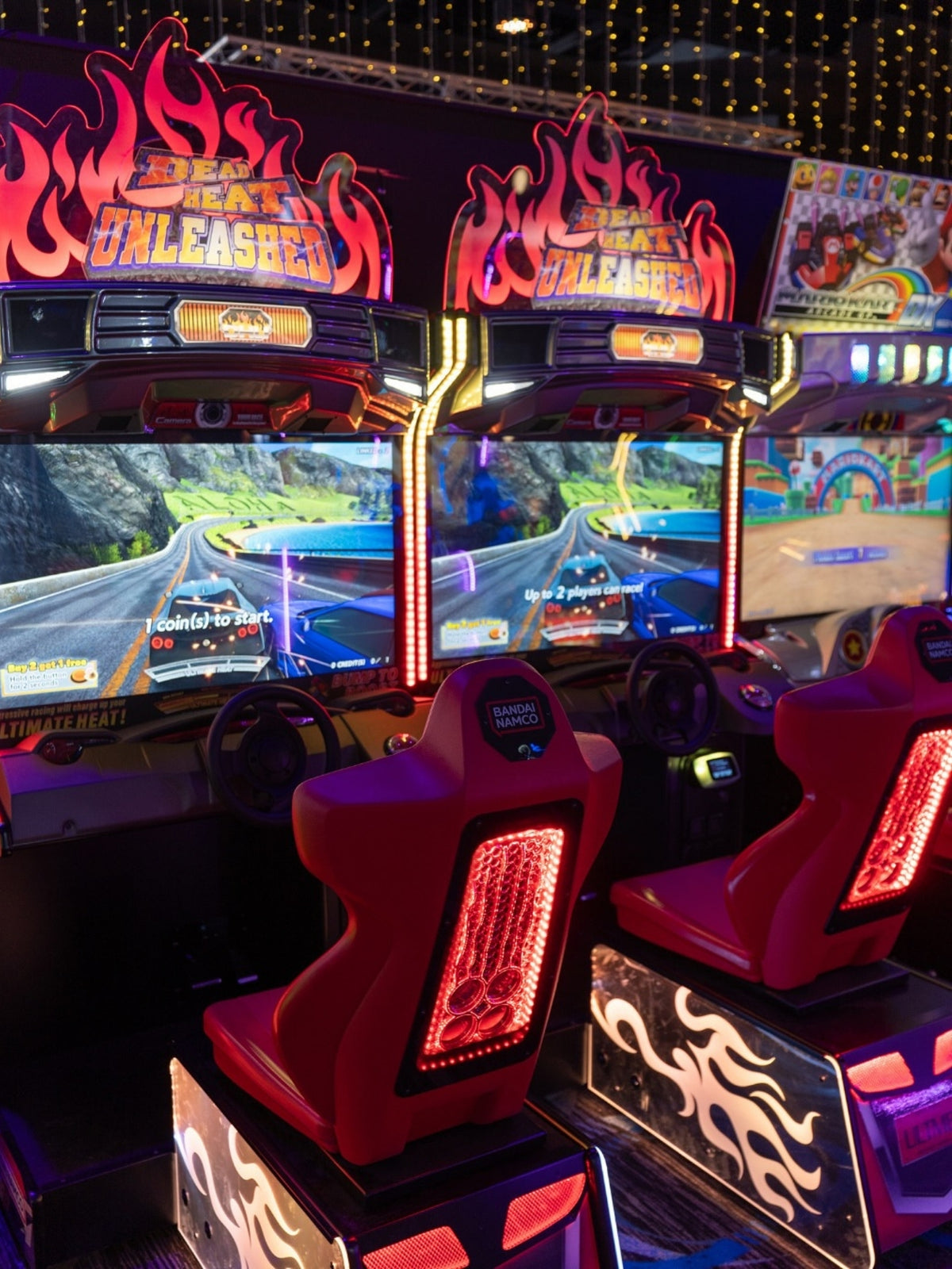 Namco Dead Heat Unleashed arcade game with 43-inch HD screen, 4-player linkable street racing, and LED-lit cabinet.