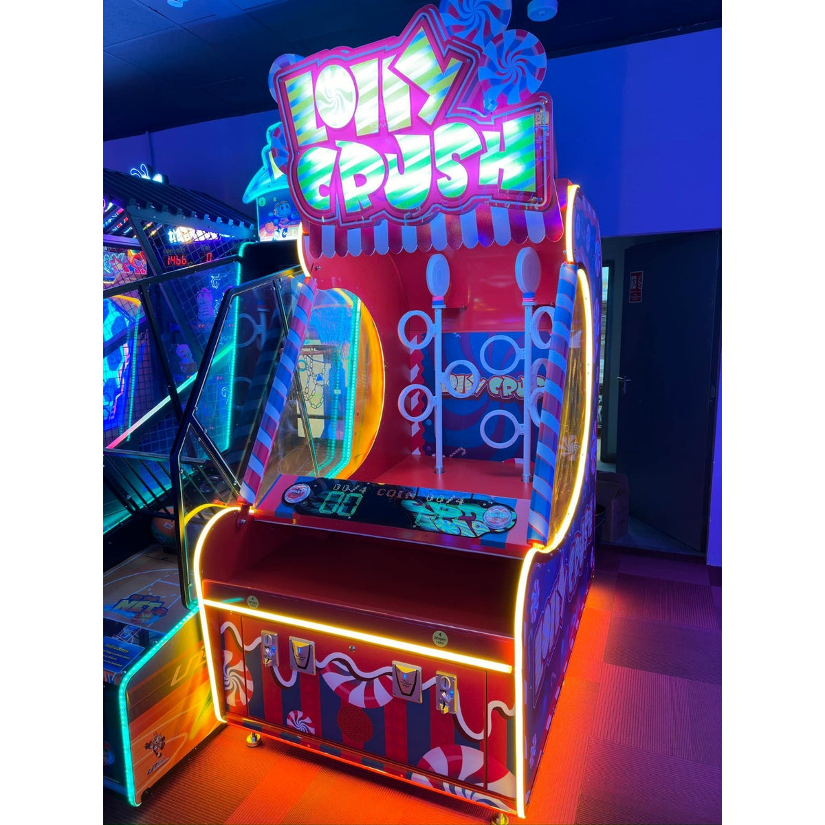 Namco Lolly Crush arcade game with spinning candy ring towers, 1–2 player skill redemption, and versus aim-and-throw gameplay.