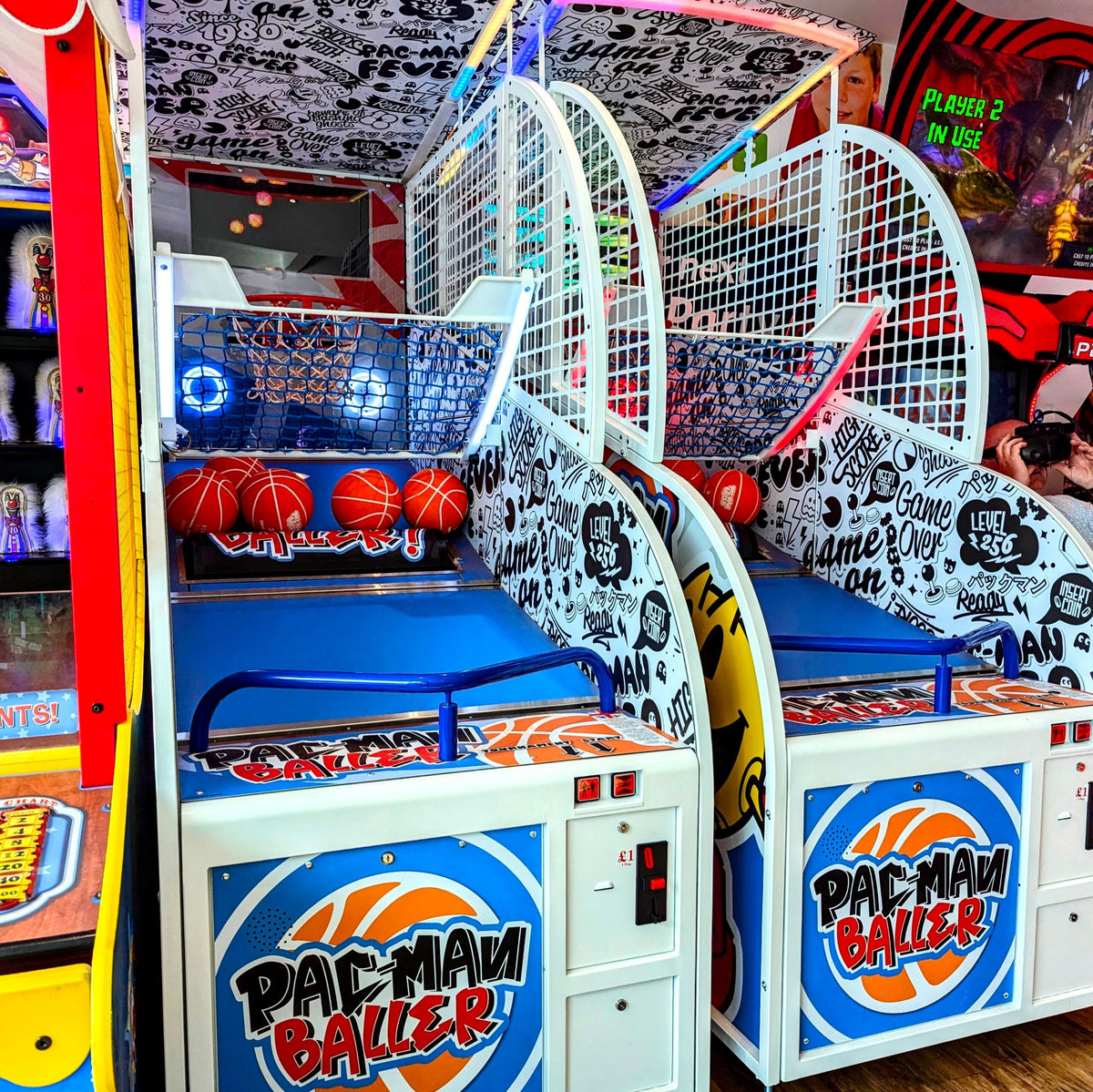 Namco Pac-Man Baller arcade basketball game with moving basket challenge, linkable multiplayer, and branded basketballs.