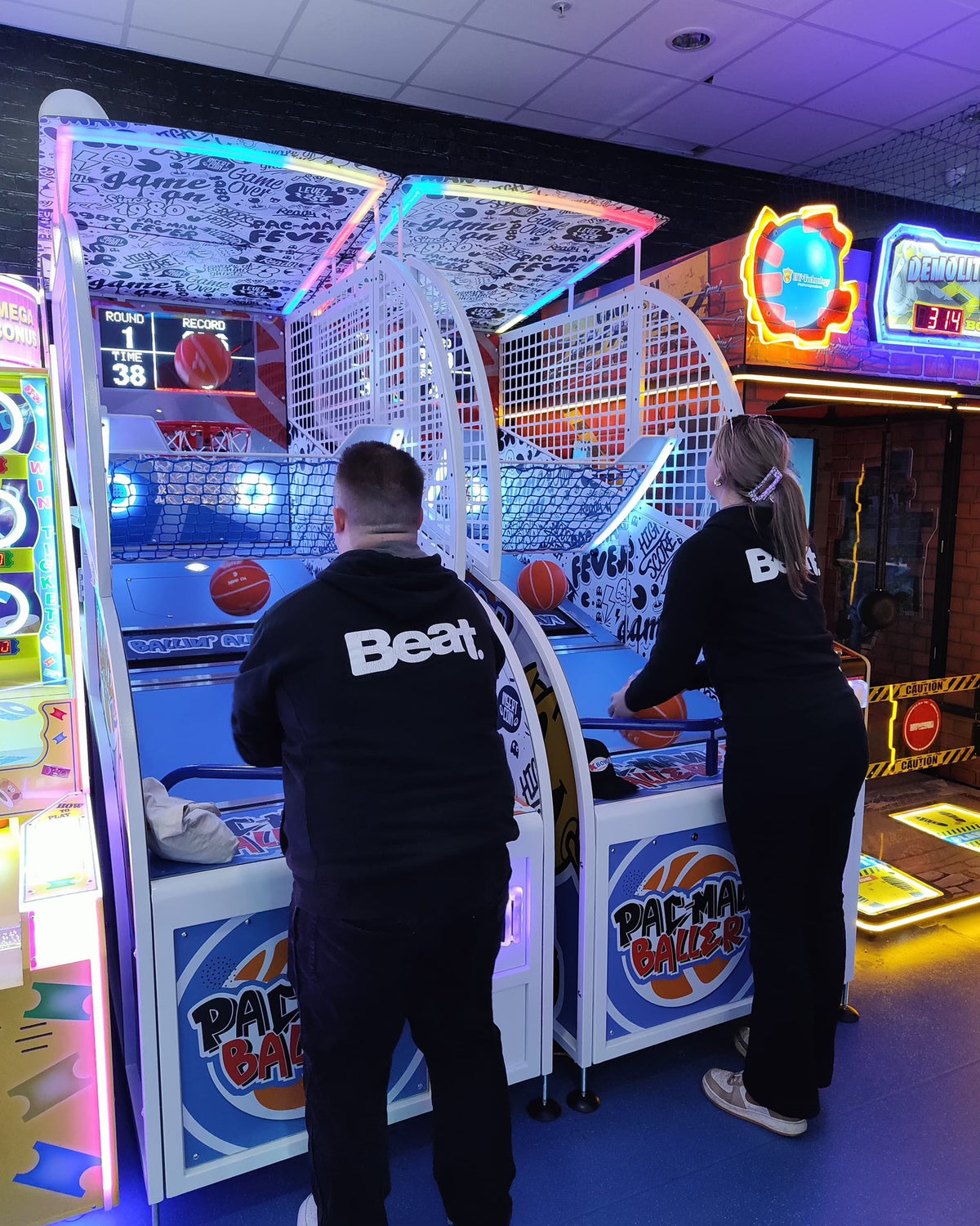 Namco Pac-Man Baller arcade basketball game with moving basket challenge, linkable multiplayer, and branded basketballs.