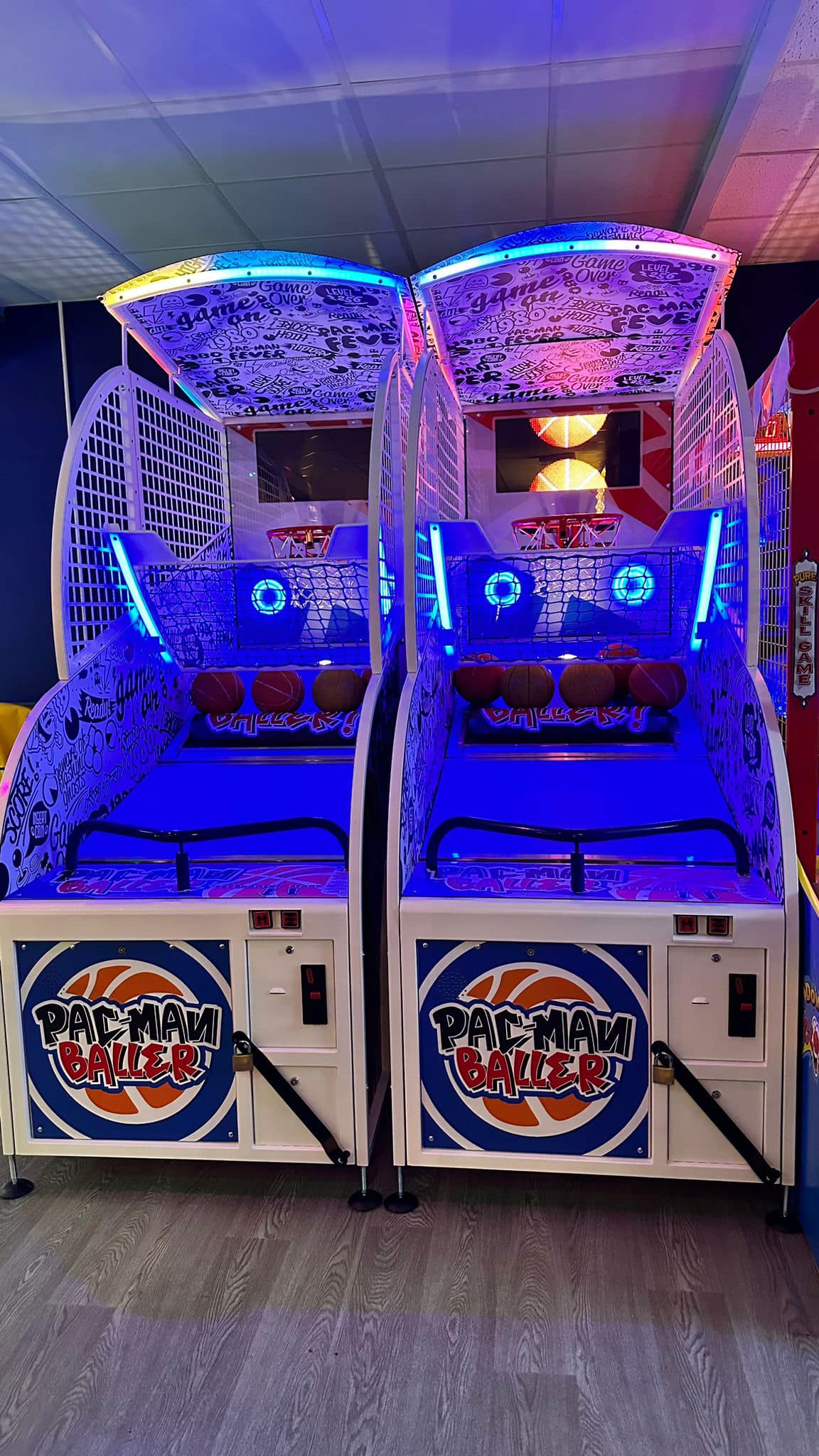 Namco Pac-Man Baller arcade basketball game with moving basket challenge, linkable multiplayer, and branded basketballs.