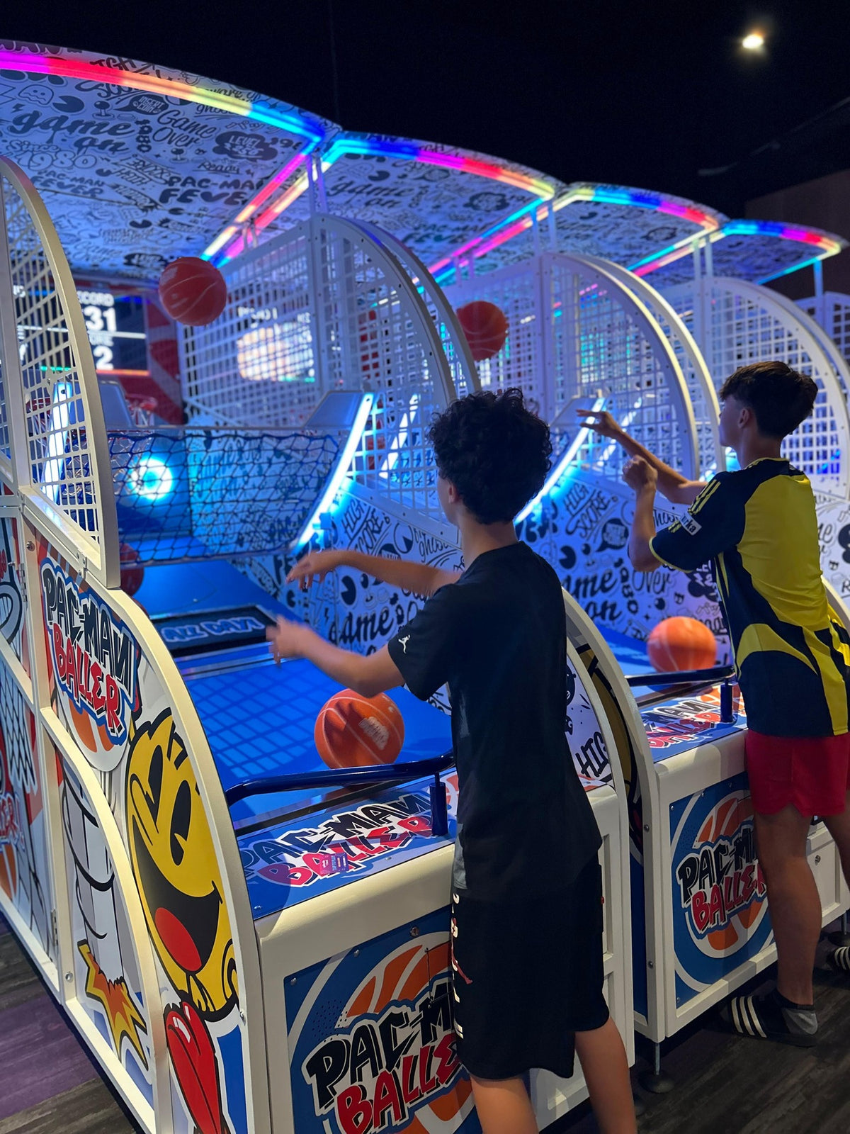 Namco Pac-Man Baller arcade basketball game with moving basket challenge, linkable multiplayer, and branded basketballs.