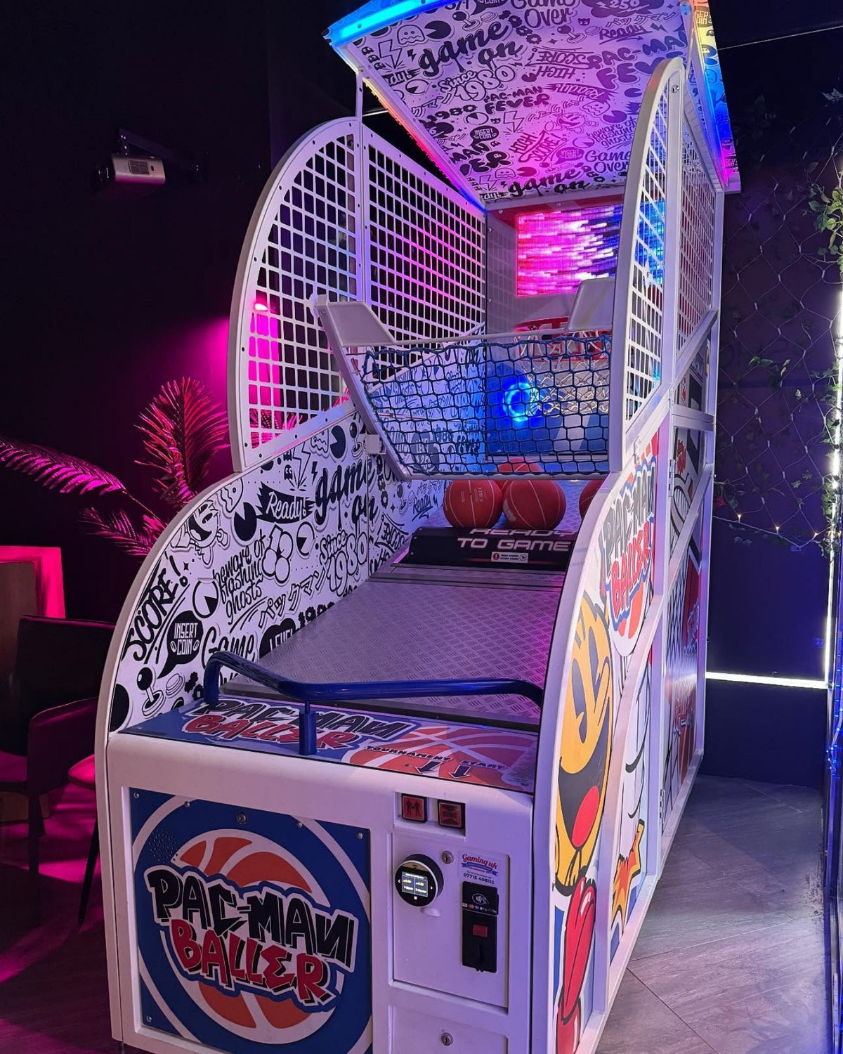 Namco Pac-Man Baller arcade basketball game with moving basket challenge, linkable multiplayer, and branded basketballs.