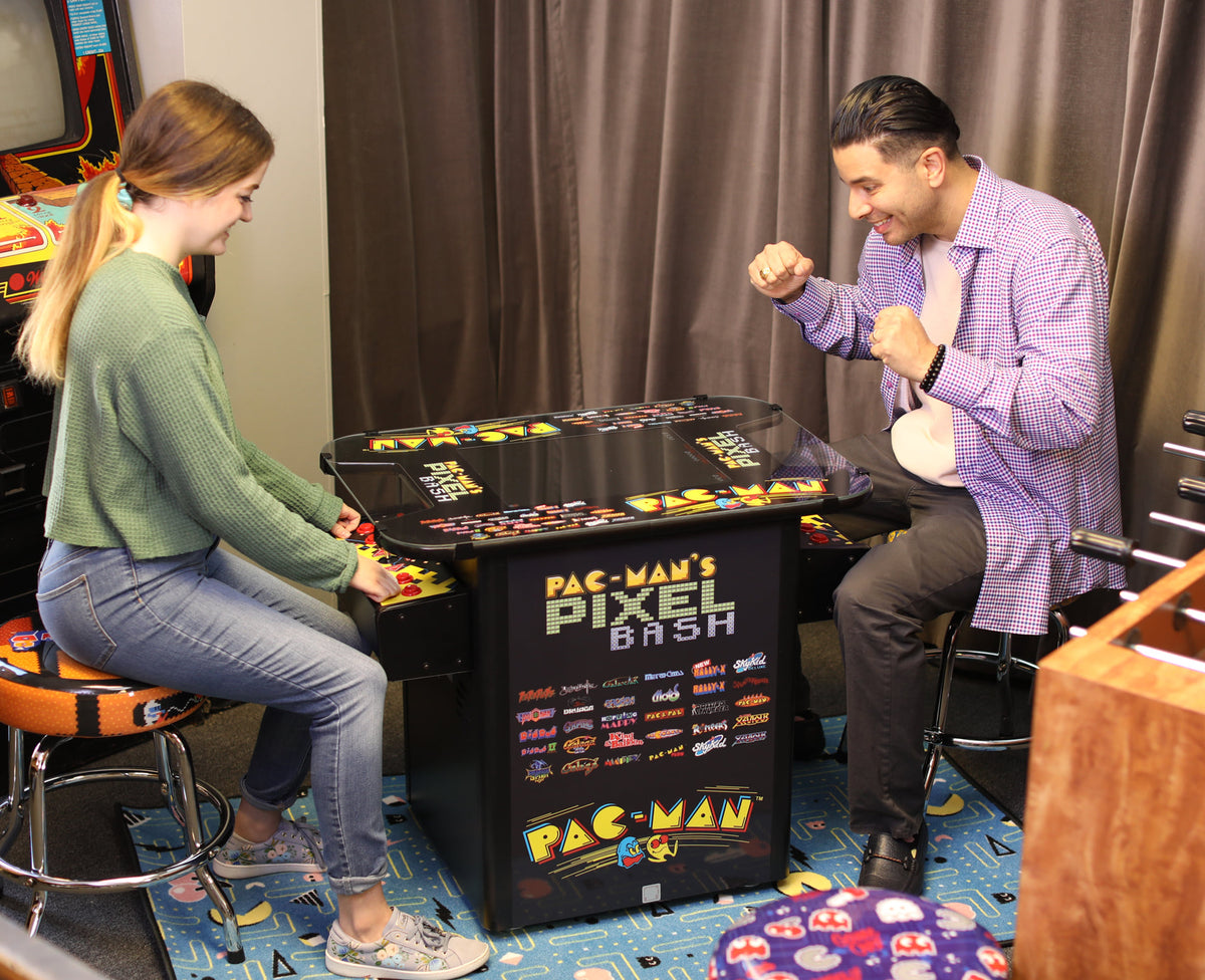 Namco Pac-Man Pixel Bash Bistro high-top arcade game with 32 classic games, retro cocktail table design, and commercial quality.