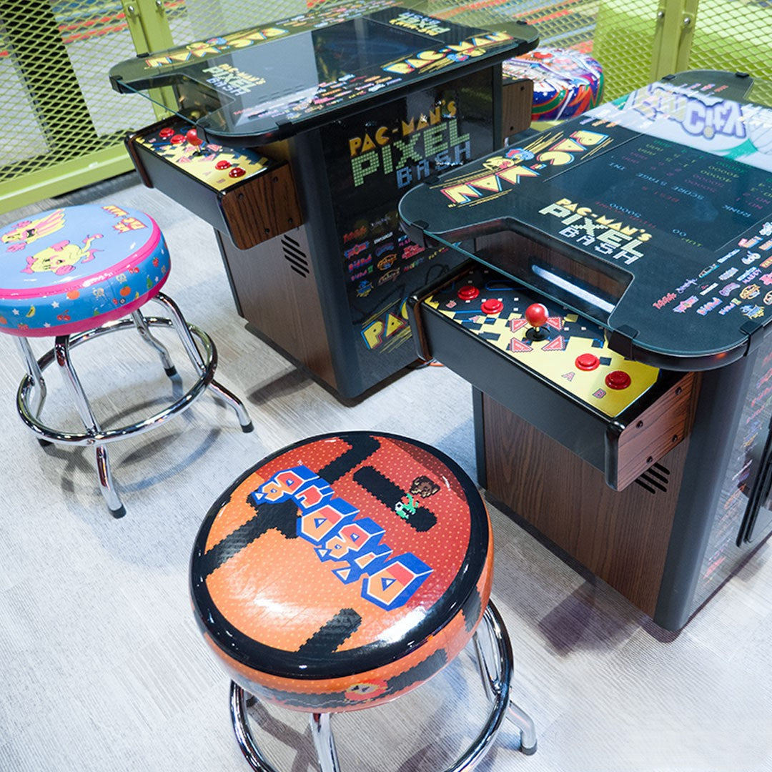 Namco Pac-Man Pixel Bash Bistro high-top arcade game with 32 classic games, retro cocktail table design, and commercial quality.