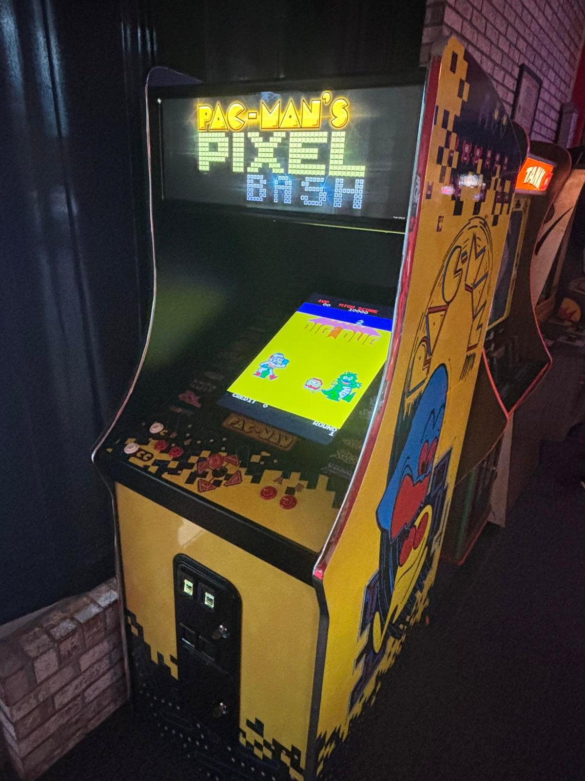 Namco Pac-Man Pixel Bash upright arcade game with 31 classic titles, retro cabinet design, and coin-op or free play options.