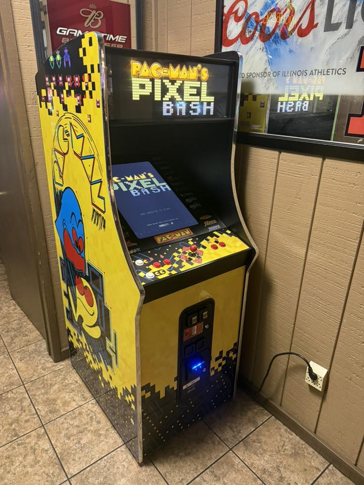 Namco Pac-Man Pixel Bash upright arcade game with 31 classic titles, retro cabinet design, and coin-op or free play options.