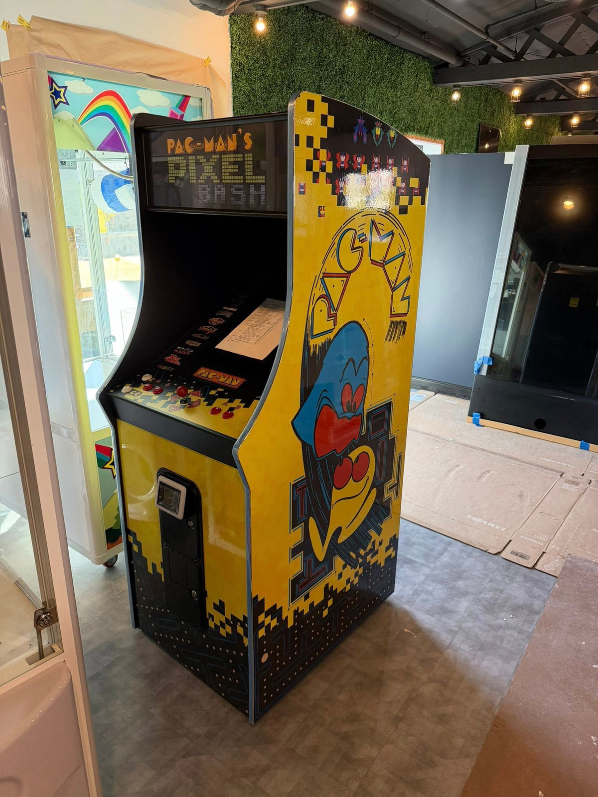 Namco Pac-Man Pixel Bash upright arcade game with 31 classic titles, retro cabinet design, and coin-op or free play options.