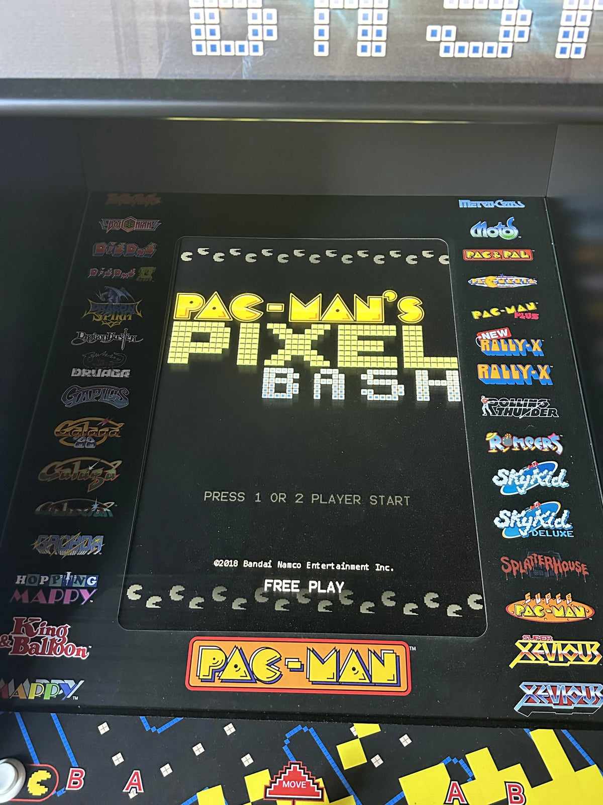 Namco Pac-Man Pixel Bash upright arcade game with 31 classic titles, retro cabinet design, and coin-op or free play options.