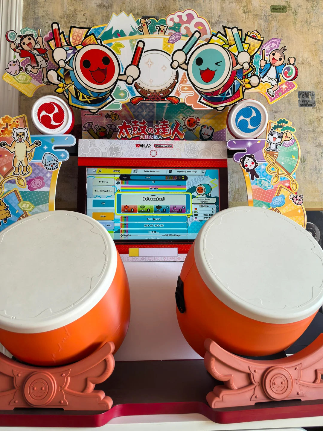 Namco Taiko No Tatsujin Drum 'N Fun arcade game with dual Taiko drums, bachi sticks, LED cabinet, and 1–2 player rhythm gameplay.