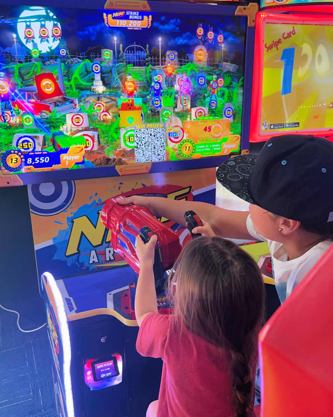 Nerf Arcade 2-player ticket redemption shooter with 65-inch HD display and foam blaster gameplay for all ages.