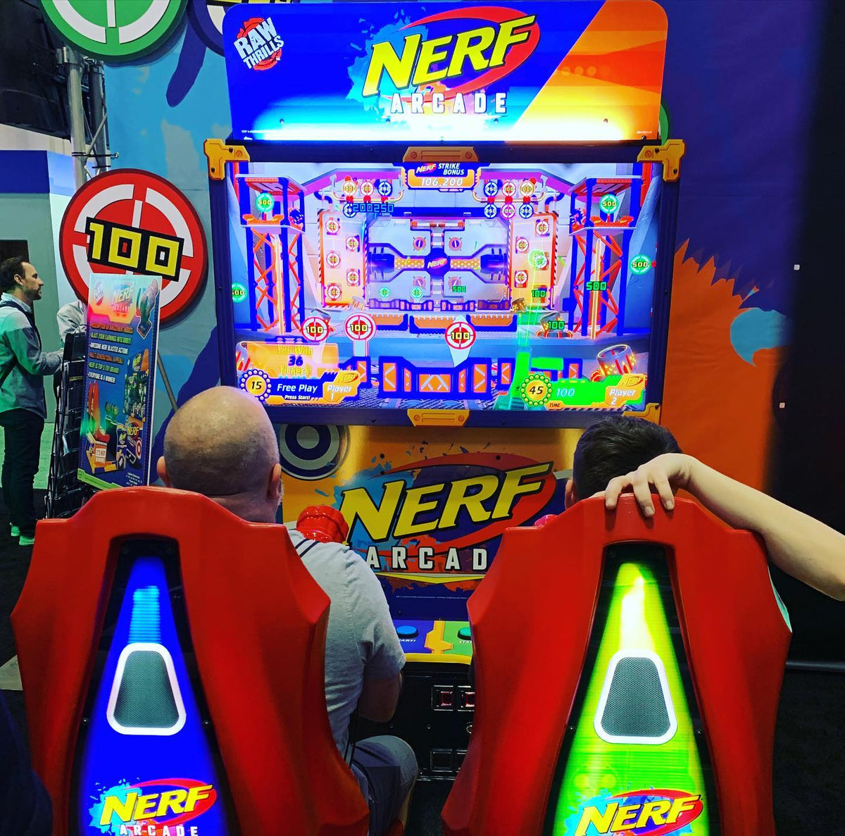 Nerf Arcade 2-player ticket redemption shooter with 65-inch HD display and foam blaster gameplay for all ages.