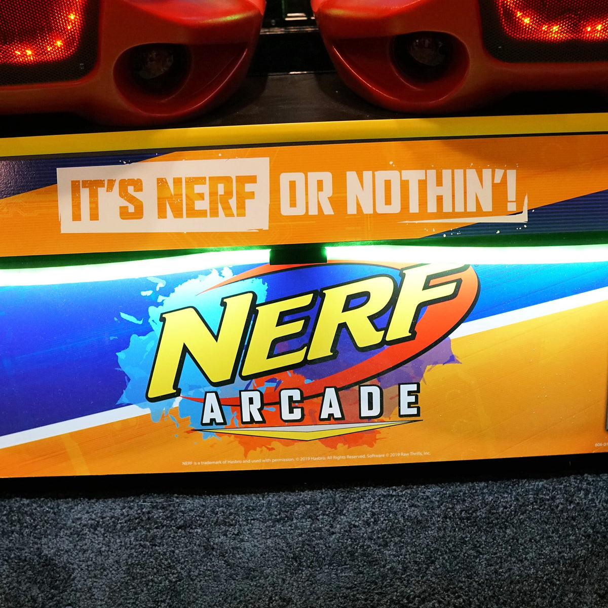 Nerf Arcade 2-player ticket redemption shooter with 65-inch HD display and foam blaster gameplay for all ages.