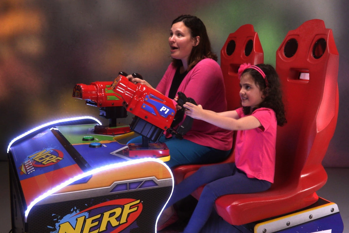 Nerf Arcade 2-player ticket redemption shooter with 65-inch HD display and foam blaster gameplay for all ages.