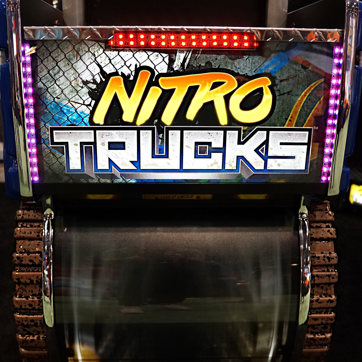 Nitro Trucks arcade machine with 43-inch HD display and force feedback steering for immersive monster truck racing.
