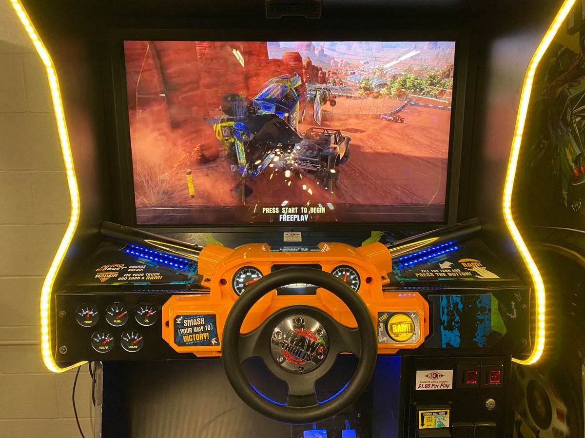 Nitro Trucks arcade machine with 43-inch HD display and force feedback steering for immersive monster truck racing.