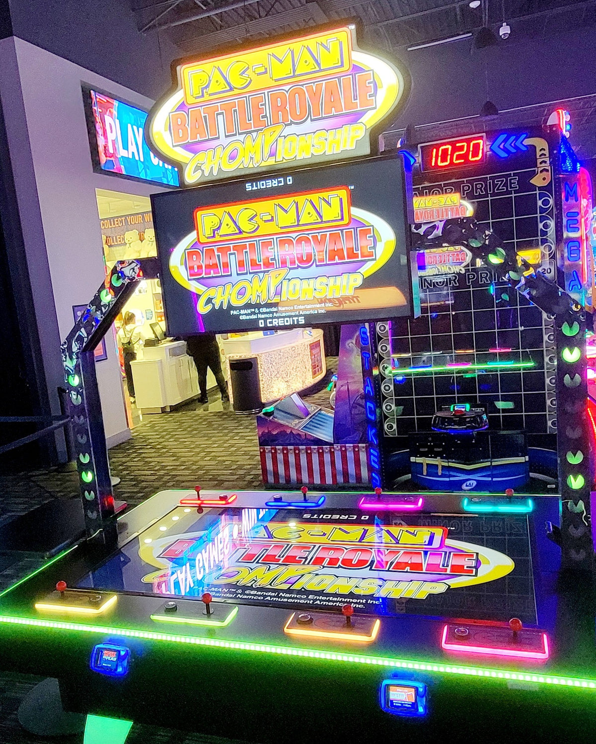 Pac-Man Battle Royale Championship Deluxe arcade game with 8-player competitive gameplay, LED cabinet, and power-up ghost battles.