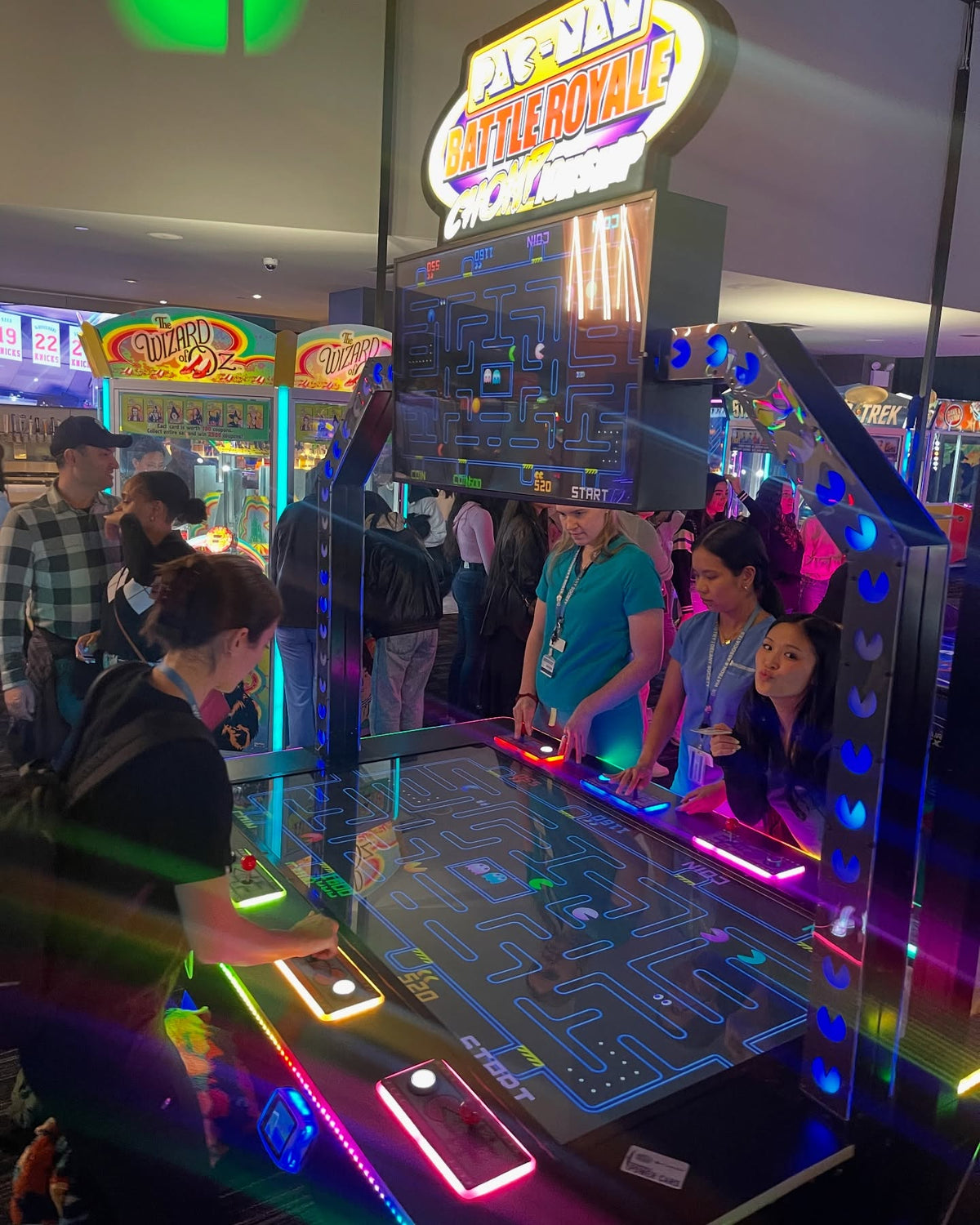 Pac-Man Battle Royale Championship Deluxe arcade game with 8-player competitive gameplay, LED cabinet, and power-up ghost battles.