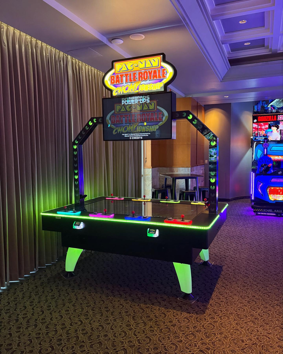Pac-Man Battle Royale Championship Deluxe arcade game with 8-player competitive gameplay, LED cabinet, and power-up ghost battles.