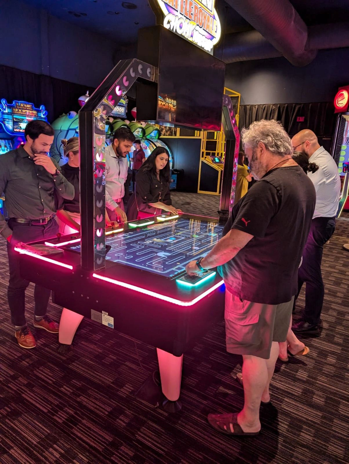 Pac-Man Battle Royale Championship Deluxe arcade game with 8-player competitive gameplay, LED cabinet, and power-up ghost battles.