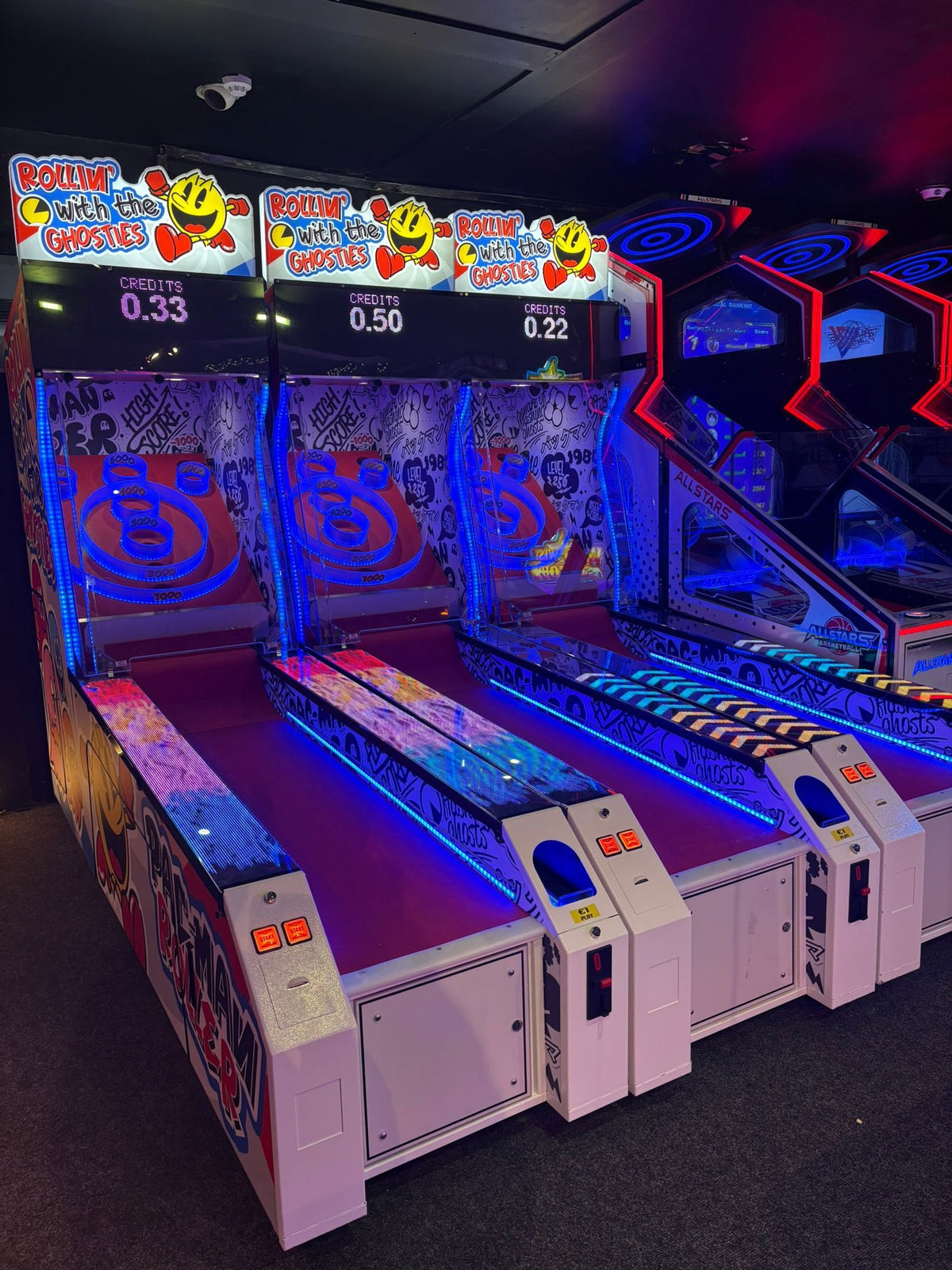 Front view of Namco Pac-Man Roller Alley arcade roller game with digital score display