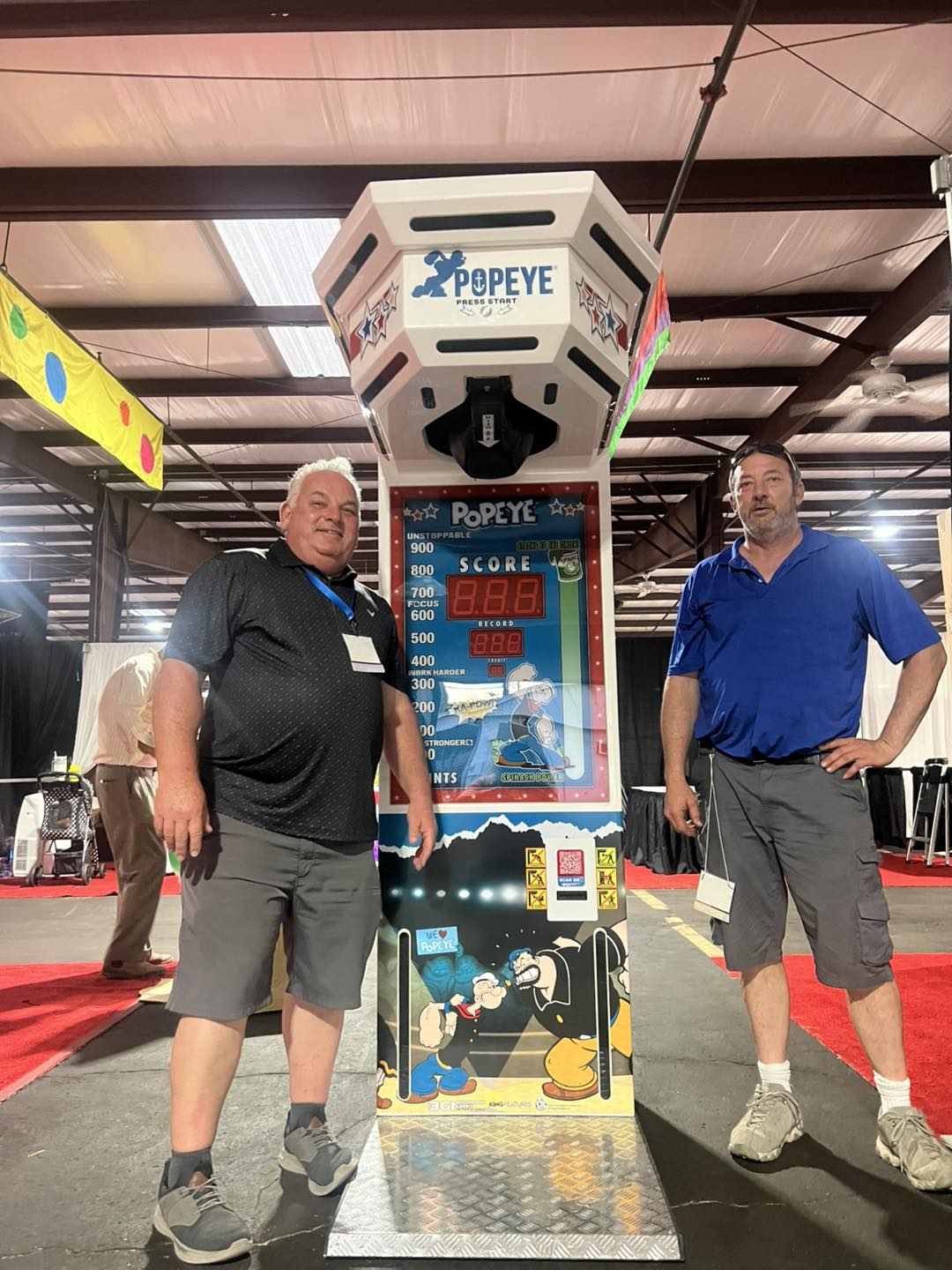 Popeye Boxer arcade machine featuring strength tester boxing gameplay with illuminated punching bag and digital display