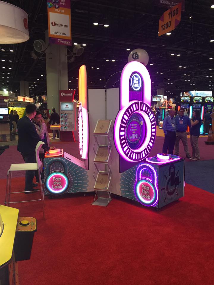 Pop the Lock arcade machine with circular LED lock display, fast-paced button timing gameplay, and bright cabinet graphics