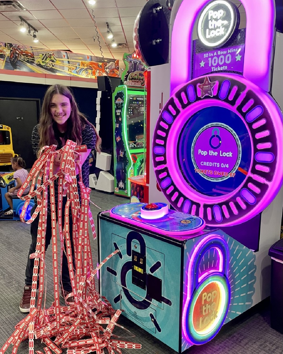 Pop the Lock arcade machine with circular LED lock display, fast-paced button timing gameplay, and bright cabinet graphics